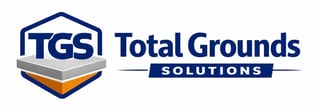 Total Grounds Solutions logo featuring geometric hexagon badge with TGS initials and company name
